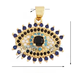 Macro detail of gold evil eye pendant with blue zircon stones and size measurements