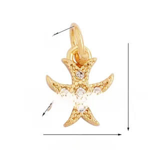 Detail of a gold-plated cross pendant with white zircon inlays and precise measurements