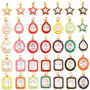 Array of colorful enamel geometric charms with gold frames and clear zircon centers