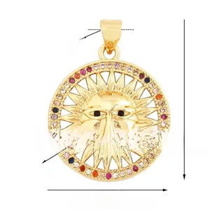 Macro shot of gold sun pendant with colorful cubic zirconia and detailed face relief