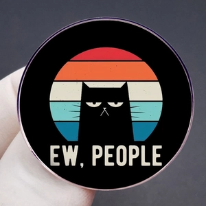 Funny black cat lapel pin with 'Ew, People' text on a retro sunset striped background