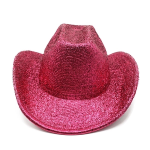Macro detail of sparkly hot pink sequins on the surface of a western cowboy party hat