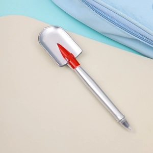 Detailed view of creative shovel-shaped ballpoint pen with silver finish and red accents