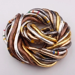 Flexible snake-bone necklace in gold, silver, and bronze finish with colorful accents