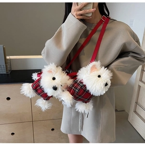 Detail of plush Westie puppy crossbody bag with red plaid outfits worn by a model