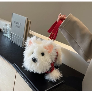 Detail of white plush Westie dog bag wearing a red plaid vest with adjustable strap
