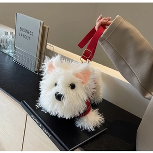 Detail of white plush puppy crossbody bag with red plaid vest and adjustable strap
