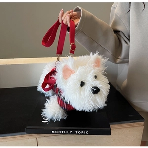 Detail of West Highland white terrier plush bag with red plaid vest and red strap