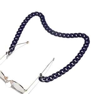 Dark blue acrylic eyeglass chain with smooth oval links on a minimal white background