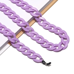Detail of purple acrylic eyewear chain with large links and black rubber loops