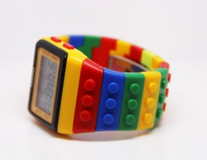 Detailed side view of a colorful building block style digital sports watch for kids