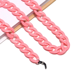 Close-up of pink acrylic eyewear chain with matte chunky links and rubber connectors