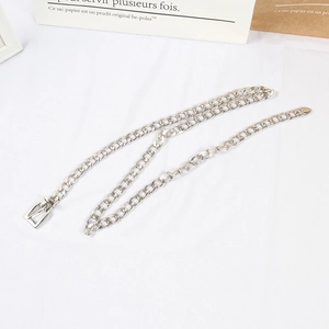 Detailed view of silver metal chain belt with square buckle for jeans on white background