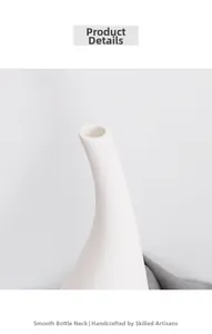Détail d'un vase en céramique blanche avec une ouverture ronde et un col mince élégant