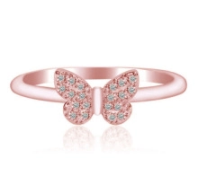 Detailed close-up of a rose gold butterfly ring featuring white pavé-set zircons on wings