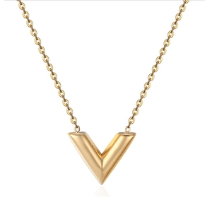 Detailed view of elegant gold V-shaped pendant necklace with polished finish on white backdrop