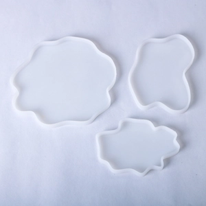 Three irregular translucent silicone molds with wavy edges for DIY resin coasters