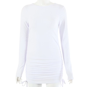 Close-up of white ribbed long sleeve dress featuring adjustable side drawstring and ruched texture