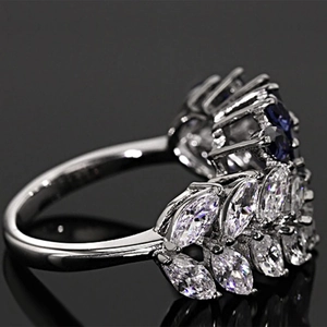 Exquisite silver floral ring with marquise-cut blue and clear stones in layered design