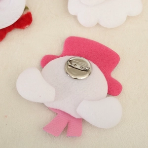 Detail view showing metal safety pin on pink plush felt brooch back for Christmas gift