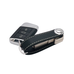 Genuine leather key organizer in black with contrast stitching and car remote keychain