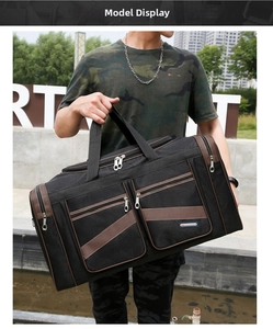 Detail of a large Oxford travel bag with dual zip pockets and side compartments