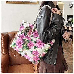 Ethnic style canvas tote bag with pink floral print and thick woven rope straps