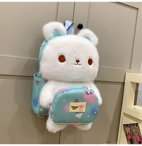 Detail of plush bunny backpack with star pattern front pocket and secure zipper closure