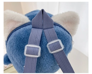Close-up of adjustable straps and plush material on the blue shark cartoon backpack