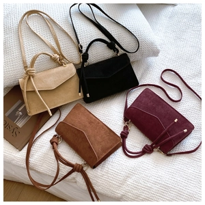 Faux suede crossbody bag in beige, black, brown, and burgundy with knotted handles