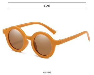 Detailed 45-degree side view of matte mustard yellow round frame kids sunglasses