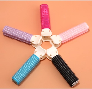 Top view of five colorful hair root clips for volume in pink, purple, blue and black
