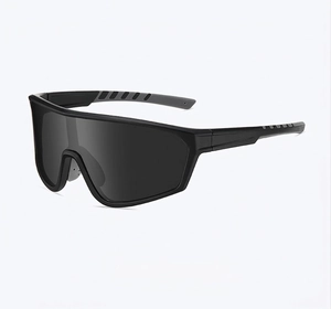 Detail view of all-black matte cycling sunglasses with anti-slip textured temples