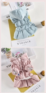 Detail of floral hooded dog jacket featuring plush lining and ruffle skirt design