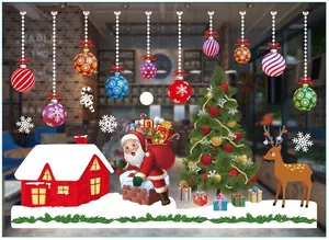 Detail showing Santa Claus, reindeer, and snowy house Christmas window stickers on glass