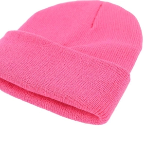 Vibrant pink ribbed knit beanie hat for winter warmth with a stylish folded cuff