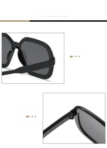 Close-up of durable metal hinge and 16-145 size specs on black oversized sunglasses