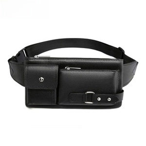 Detailed macro view of black pebble grain leather texture and metallic hardware on waist bag