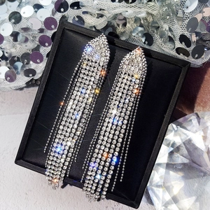 Sparkling silver rhinestone tassel drop earrings in a luxury jewelry gift box display