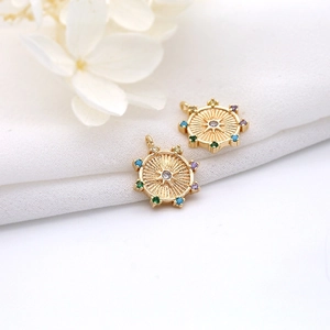 Detailed macro of 14K gold-plated star pendants with colorful zircon gemstones