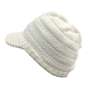 Side view detail of white cable knit peaked ski hat with ear protection for winter warmth