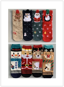 Detailed grid of eight festive Christmas cotton socks featuring reindeer and snowman patterns