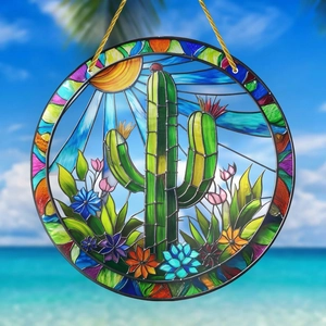 Detail of bohemian acrylic round pendant featuring cactus and sun against beach backdrop