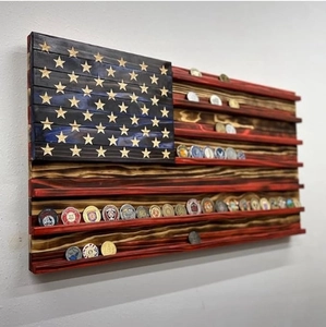 Side view of wooden American flag coin display rack showing shelves and carved stars