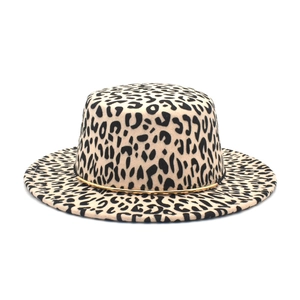 Close-up of leopard print wool felt boater hat with delicate gold metal chain detail