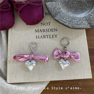 Pink ribbon bow keychain with silver heart charm and metal rings for bag decoration