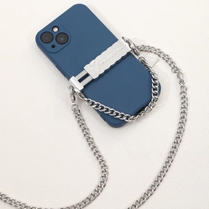 Detail of blue phone case with silver metal chain and engraved you are still here plate