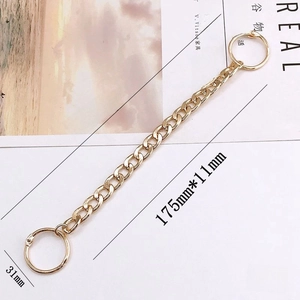 Detail of gold acrylic chain with round clasps for garden clog decoration