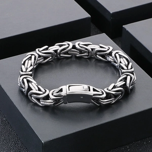 Macro shot of silver Byzantine chain bracelet in titanium steel with a secure box clasp