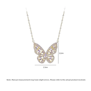 Detail view of butterfly pendant with purple crystals and 2.3cm measurement markings